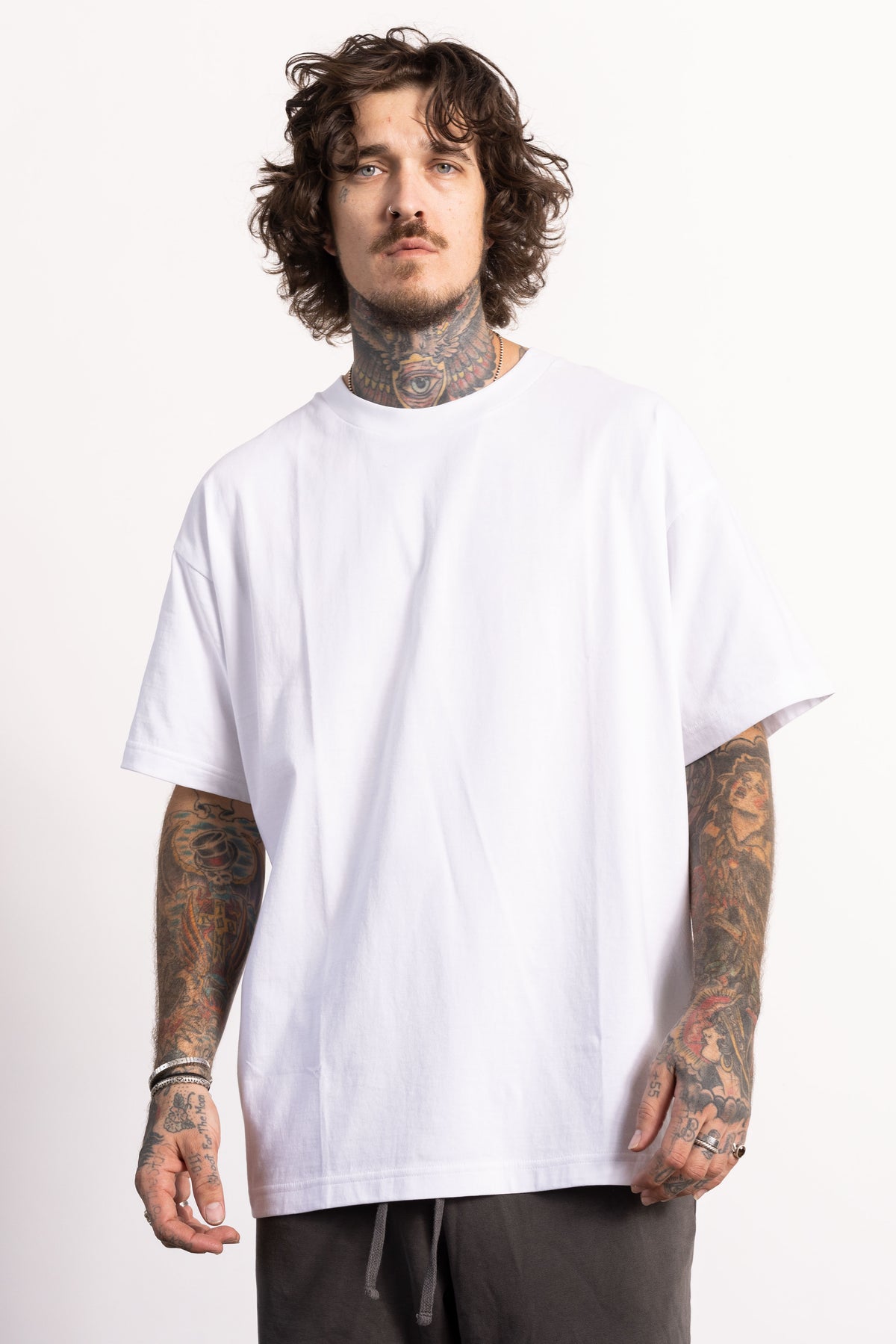 White male model with edgy style wearing a heavyweight cotton Classic Fit T-shirt.