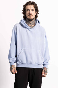 White male model with edgy style wearing a heavyweight cotton light blue hoodie