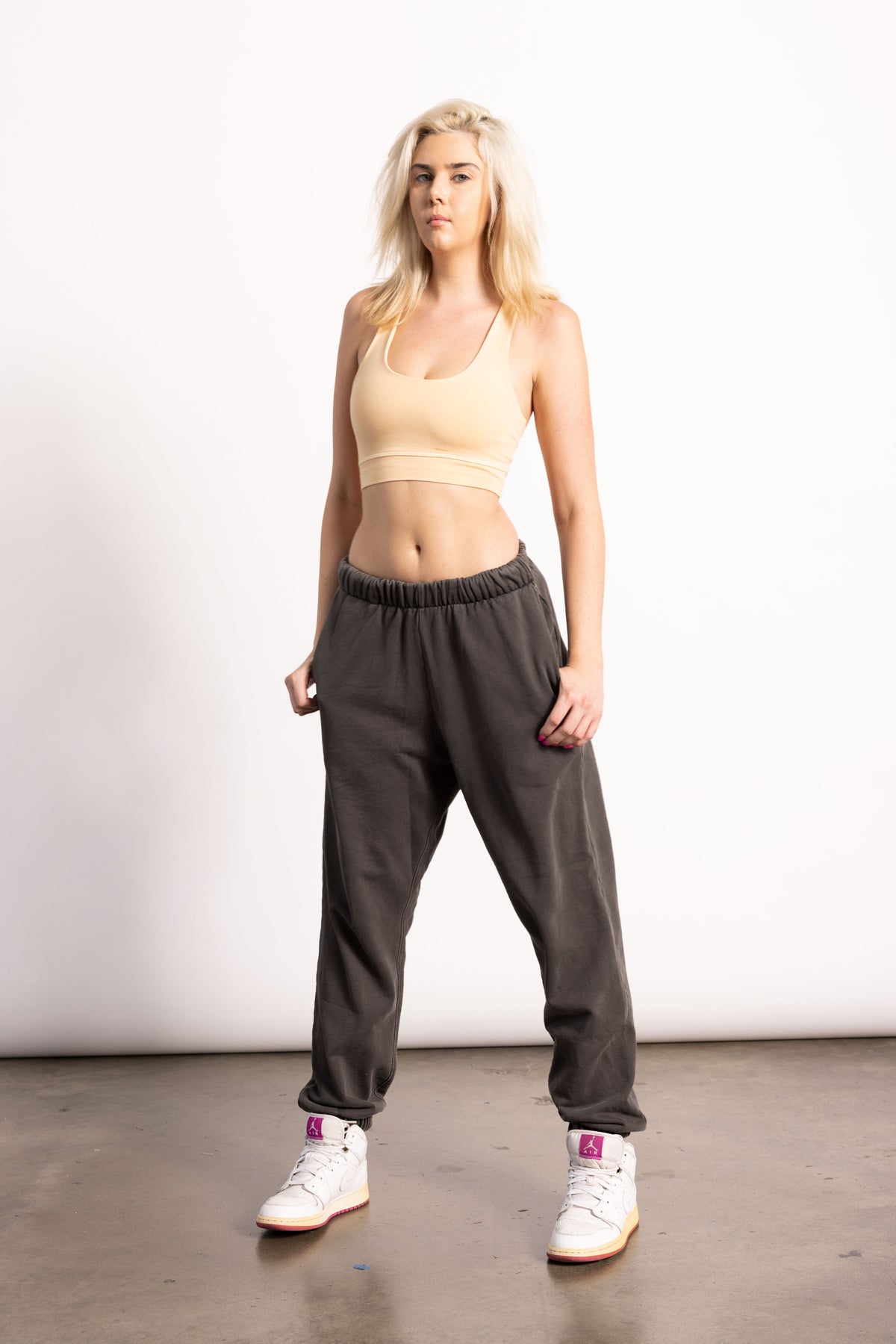 White female model with edgy style wearing a Pima cotton sweatpants.