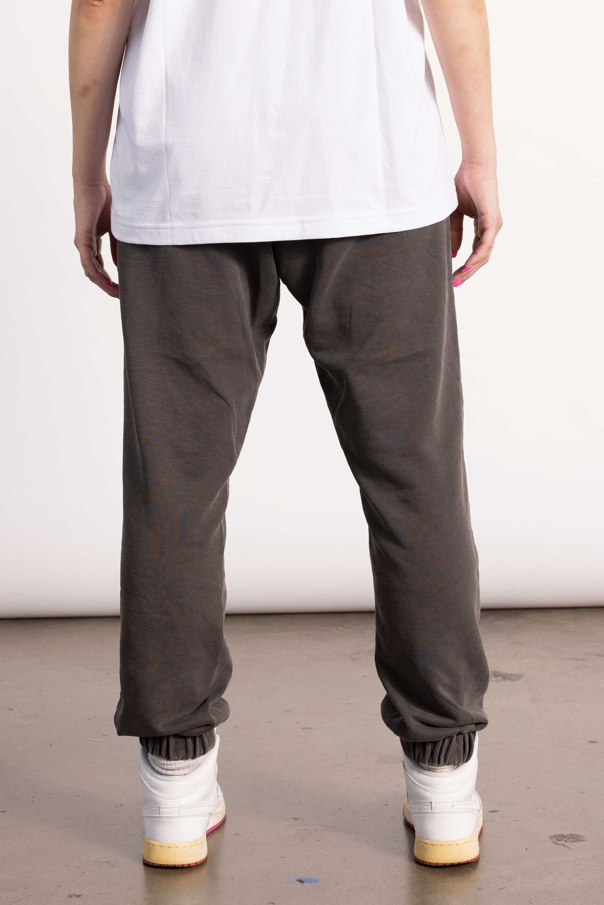 White female model with edgy style wearing a Pima cotton sweatpants.