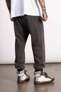 White male model with edgy style wearing a Vintage Black Pima cotton sweatpants.