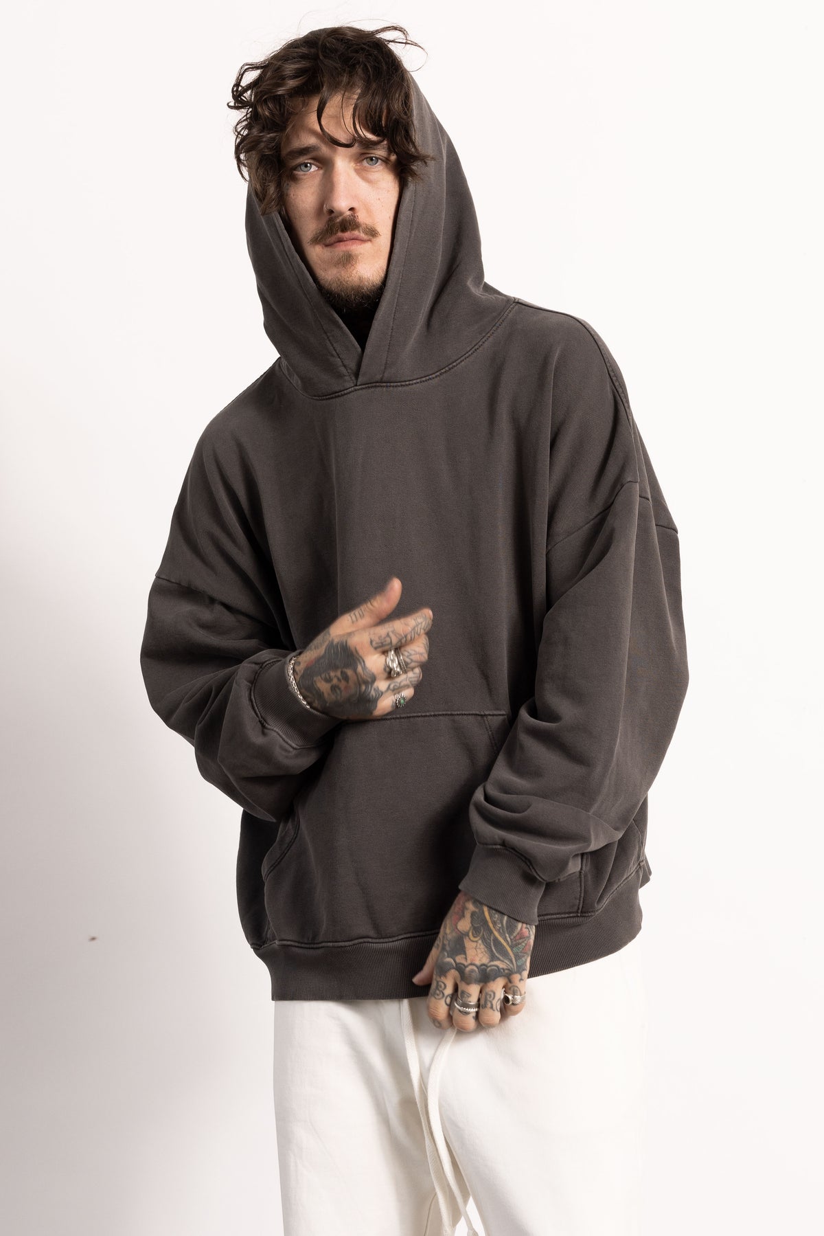 White male model with edgy style and tattoos wearing a Drop Shoulder Pima Cotton Hoodie