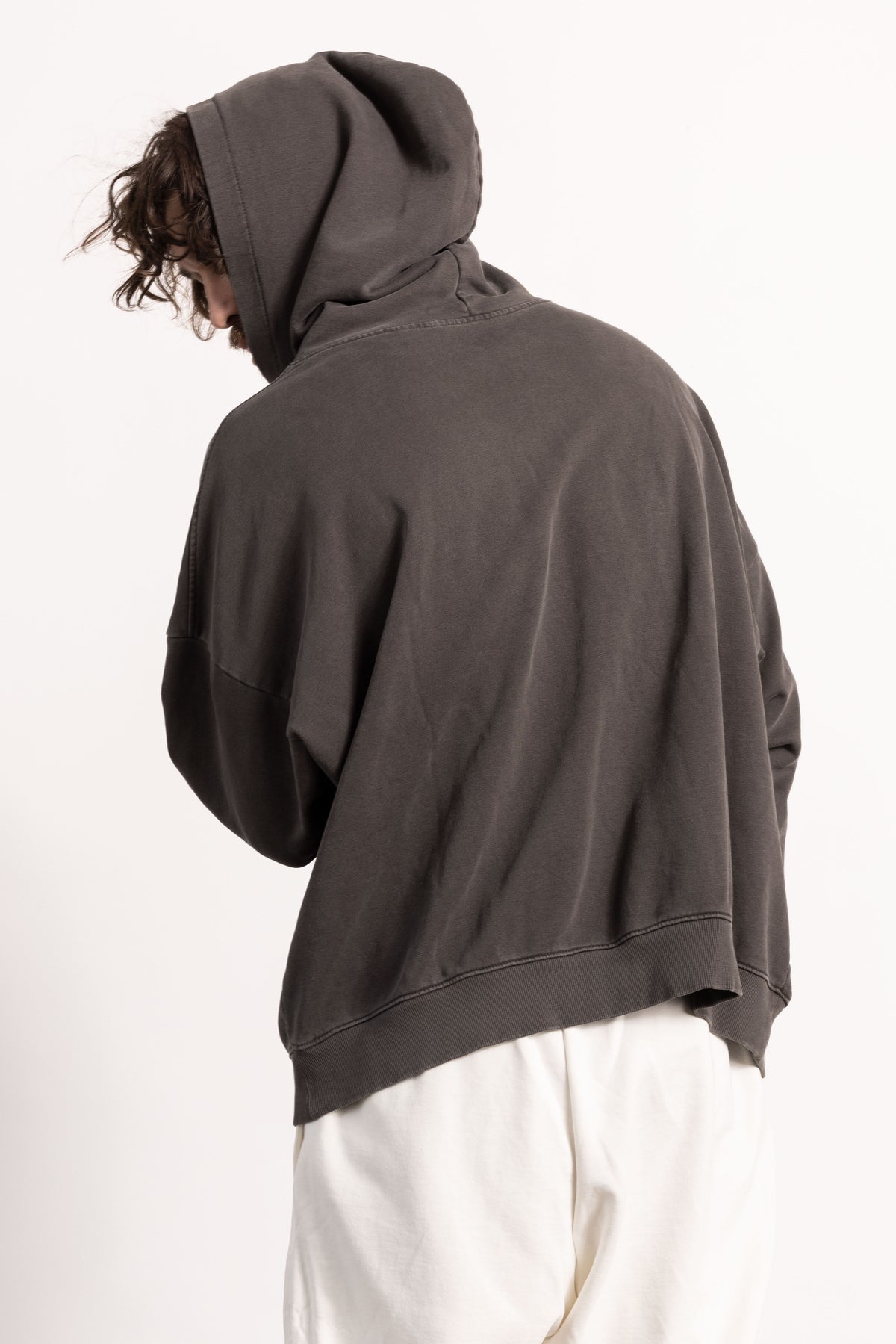 White male model with edgy style and tattoos wearing a Drop Shoulder Pima Cotton Hoodie