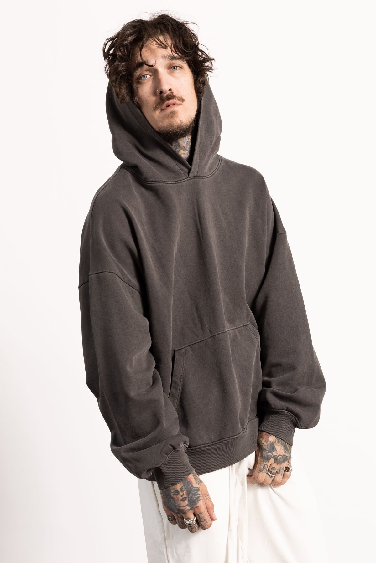 White male model with edgy style and tattoos wearing a Drop Shoulder Pima Cotton Hoodie