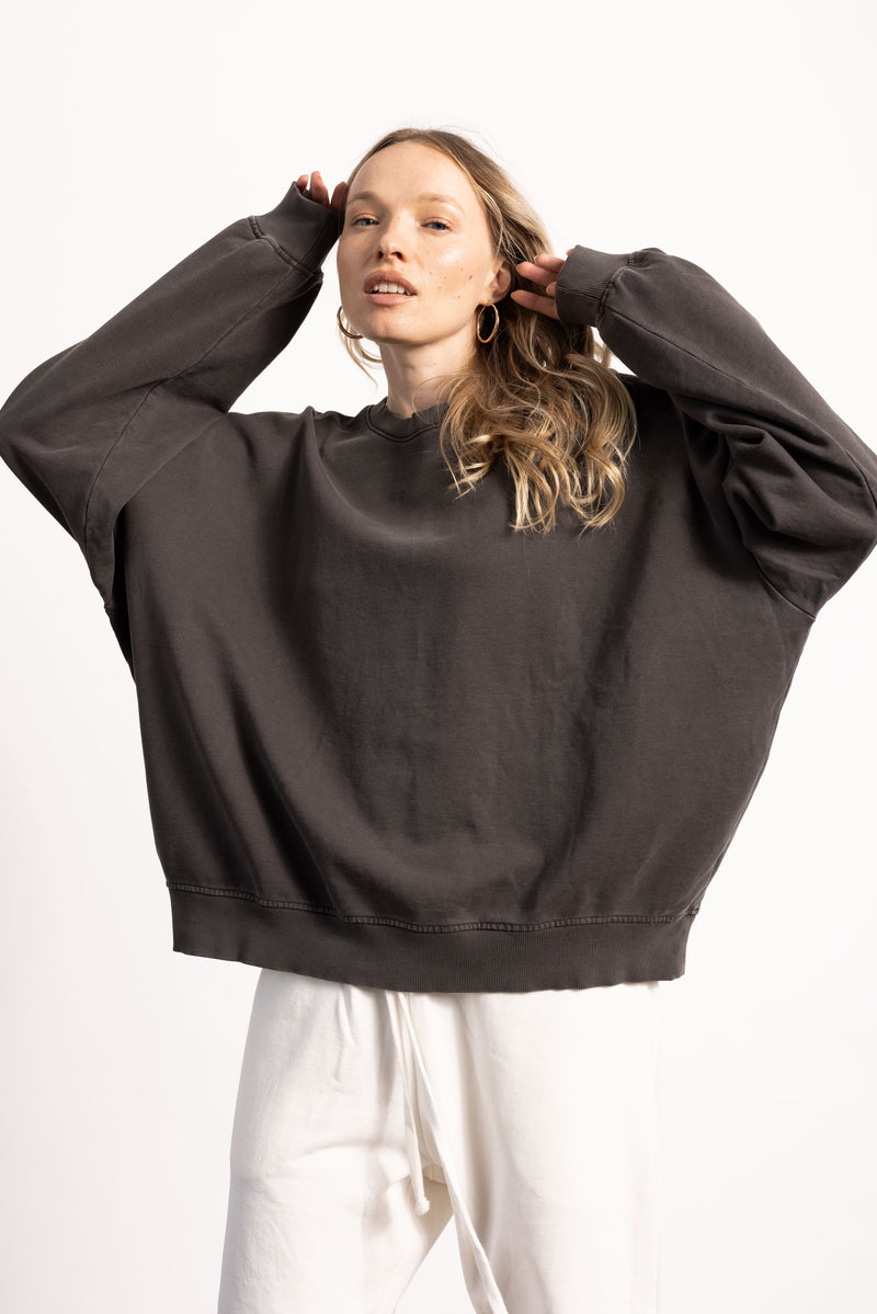 White female model with edgy style wearing a heavyweight Pima Cotton Crewneck Sweatshirt