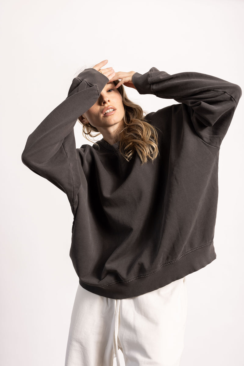 White female model with edgy style wearing a heavyweight Pima Cotton Crewneck Sweatshirt