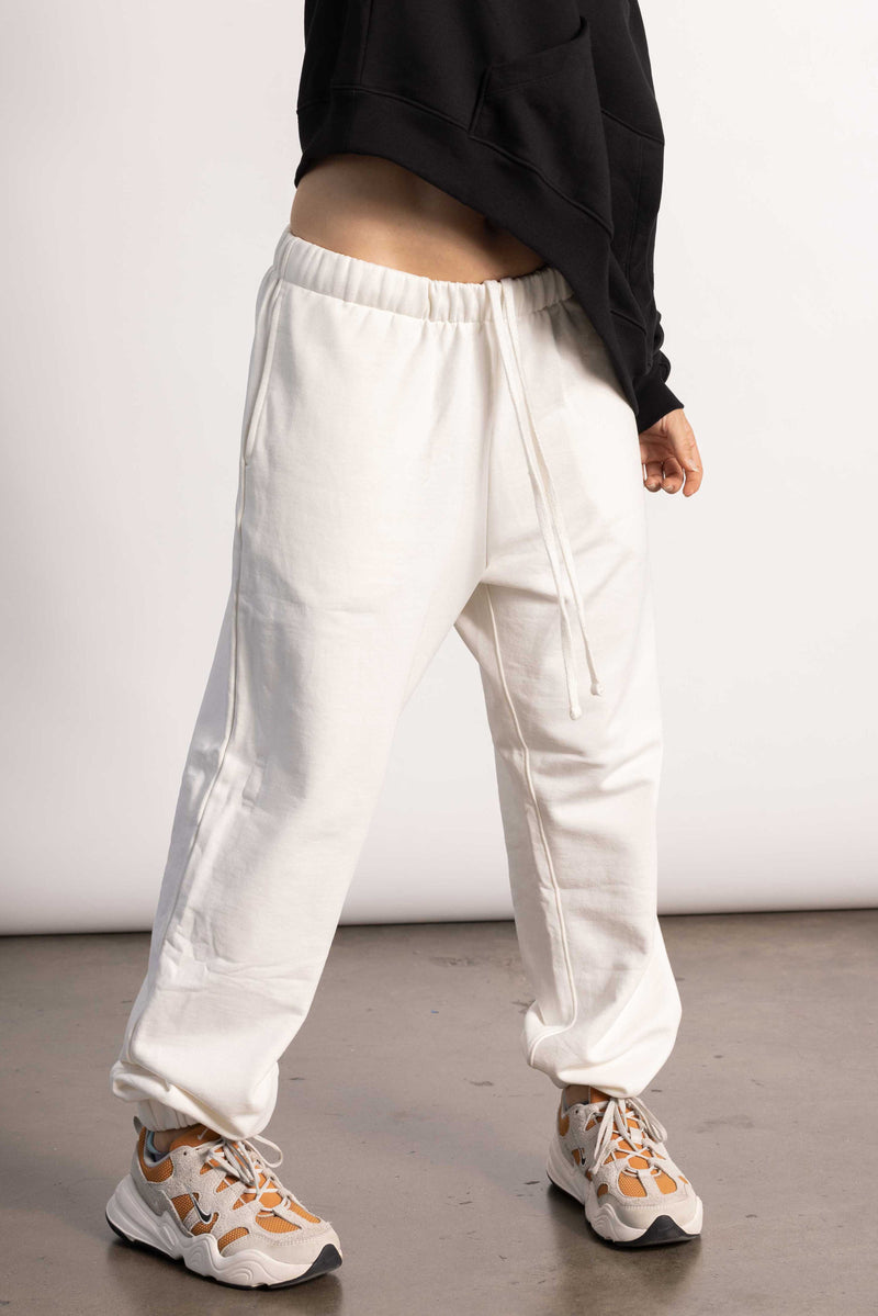 White female model with edgy style wearing an off white Pima Cotton Oversized Pants
