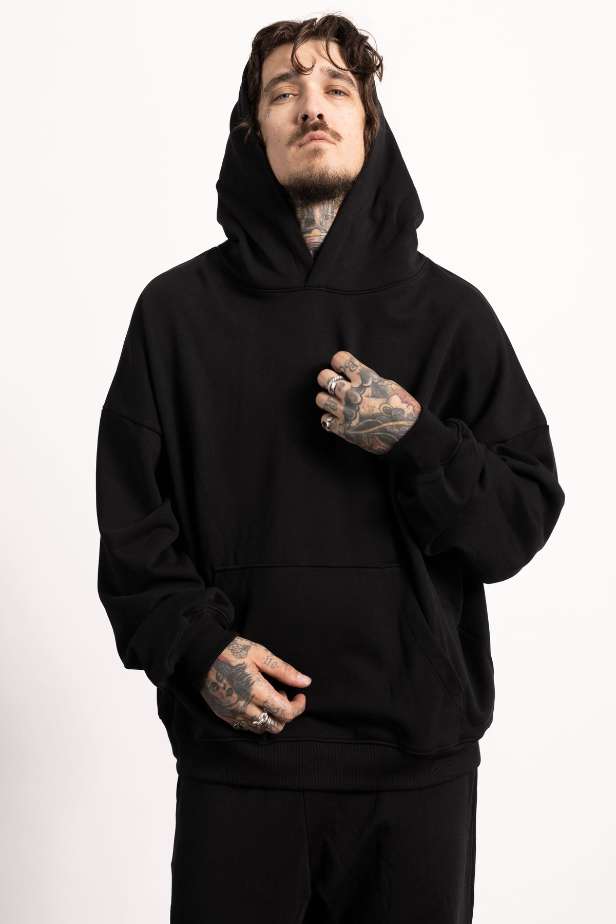 White male model with edgy style and tattoos wearing a Drop Shoulder Pima Cotton Hoodie