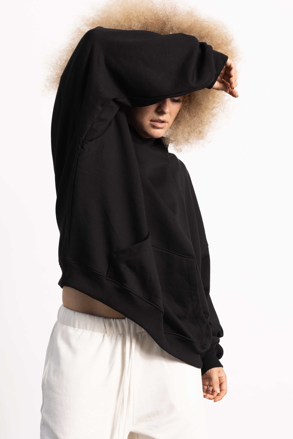 White female model wearing a Drop Shoulder Pima Cotton Hoodie