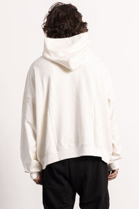 White male model with edgy style and tattoos wearing an off while Drop Shoulder Pima Cotton Hoodie