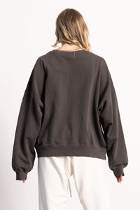 female blond model wearing an oversized sweatshirt